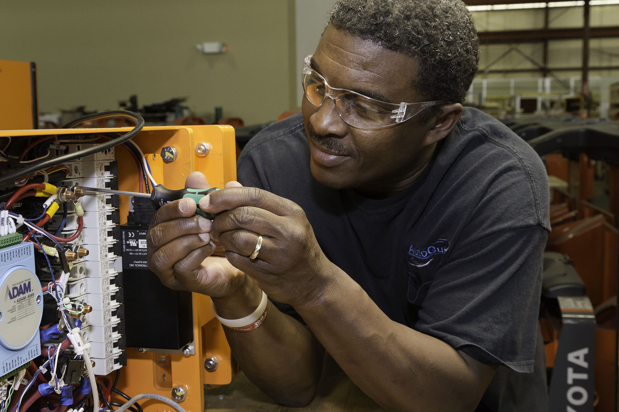 detail of man working in robotics fabrication