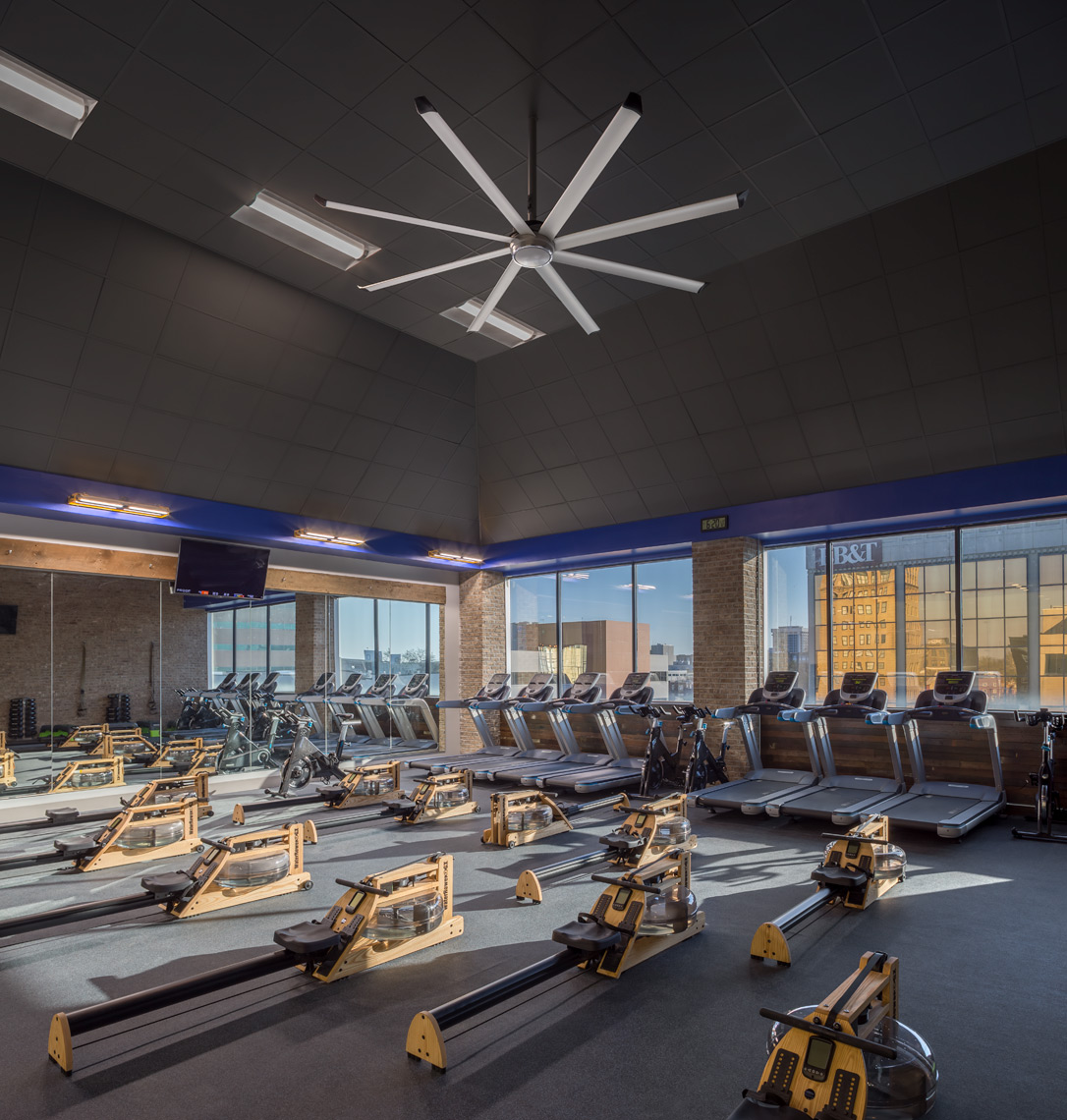 Rowing gym and treadmills at proof fitness with lighting application