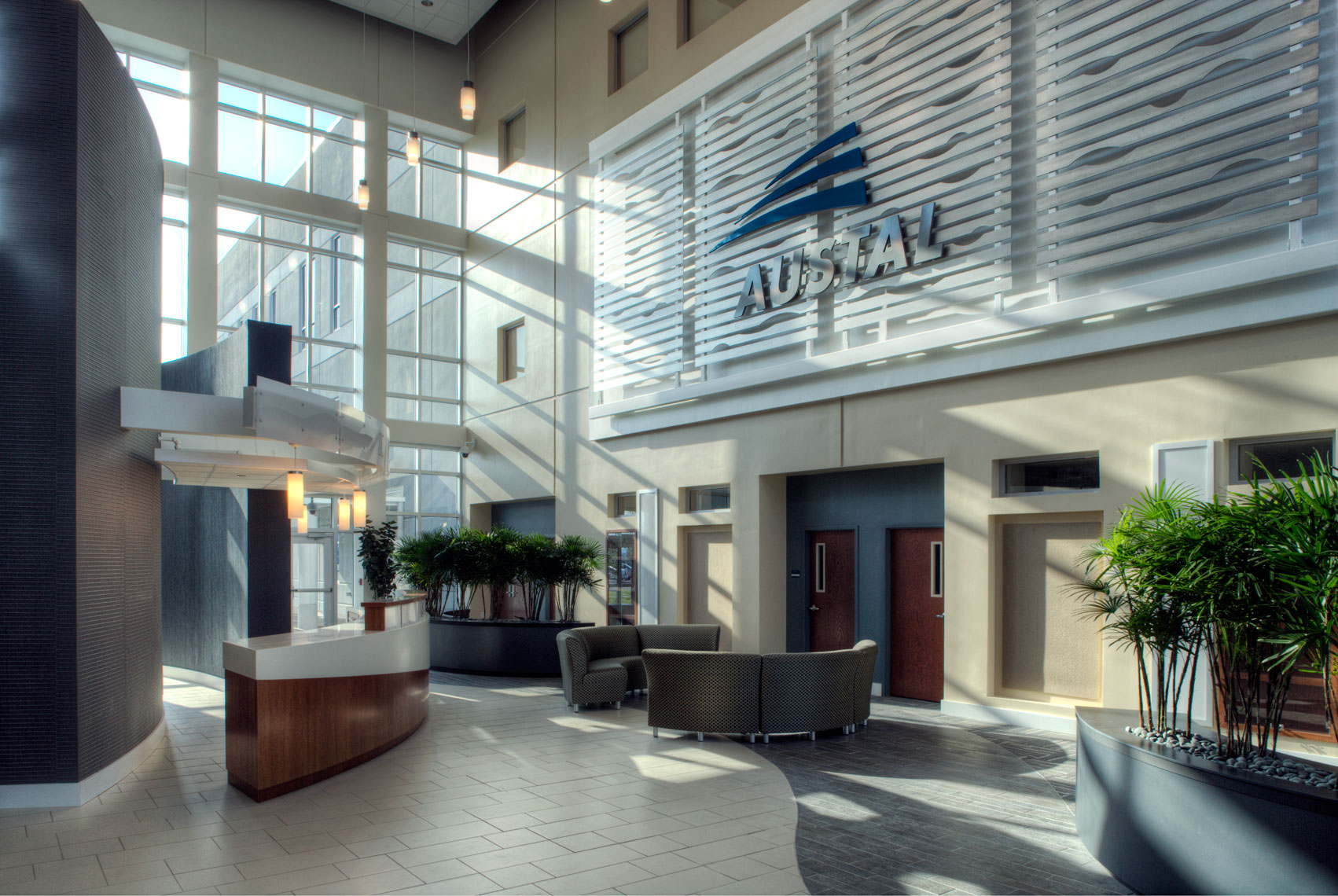 Sunlit atrium and reception at Austal USA