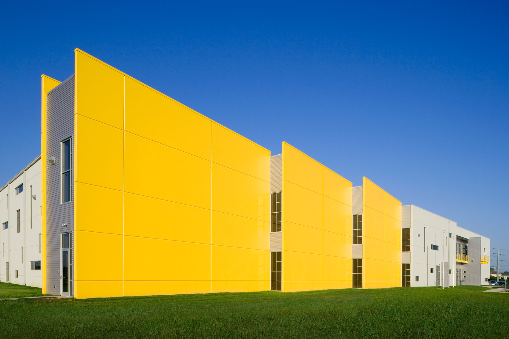 Modern office and manufacturing facility with yellow walls