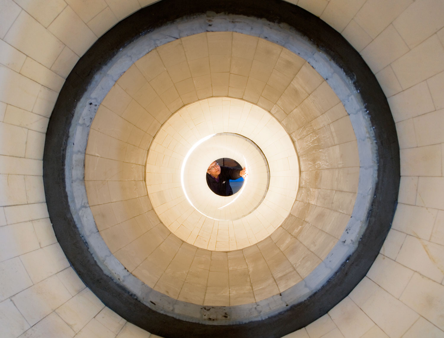 man inspecting clean coal centrifuge