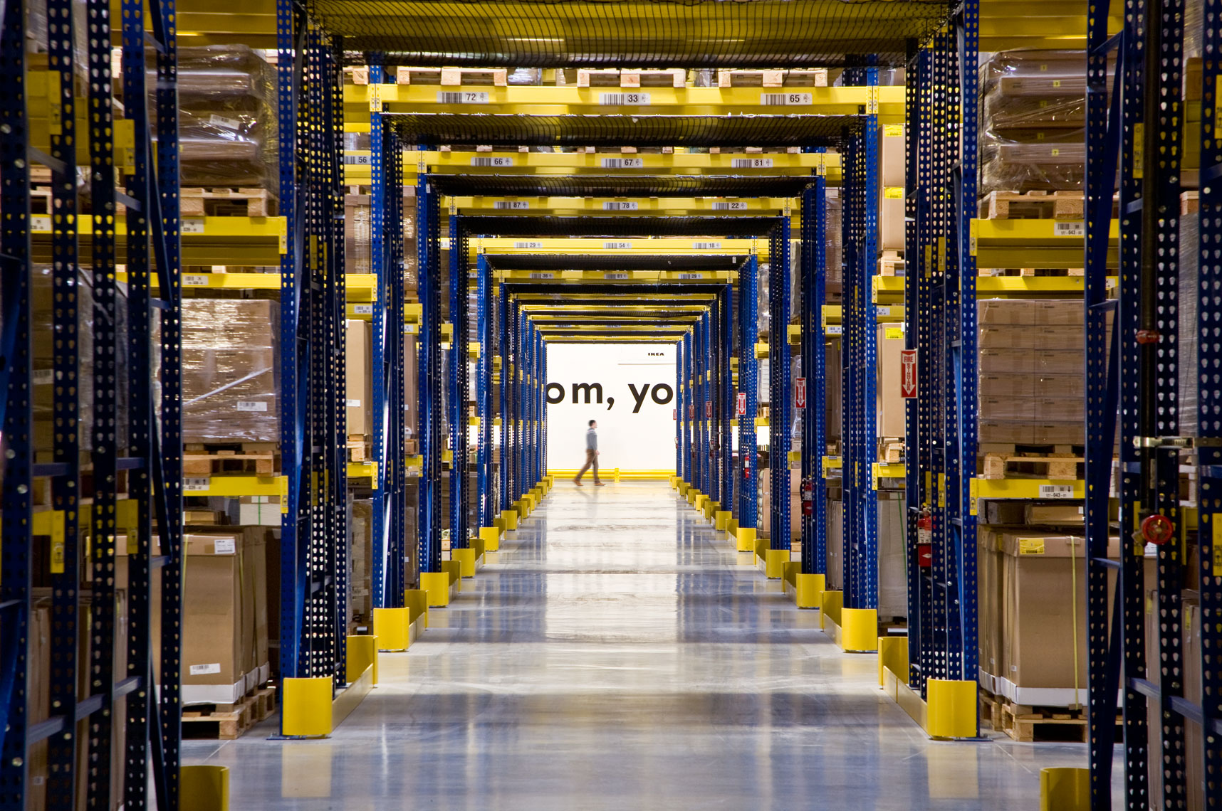 Man walking through extensive IKEA Distribution Center