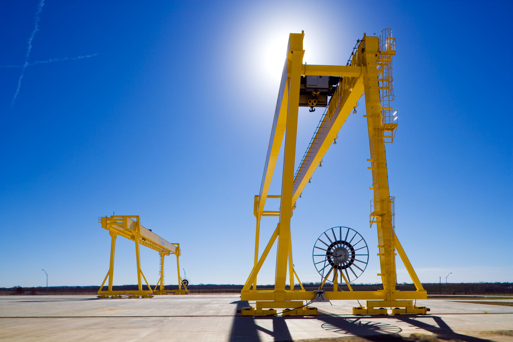 two massive exterior cranes on rails
