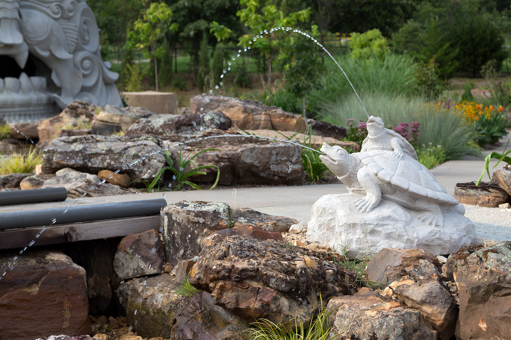 turtle sculptures spraying water at tulsa botanic garden